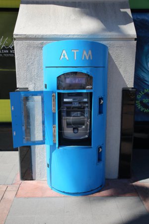 Photo for Huntington Beach, CA. - USA - September 19, 2022: ATM "Automatic Teller Machine" stands in front of a building to dispense Cash or Money to people who are short on finances but have money in the bank - Royalty Free Image