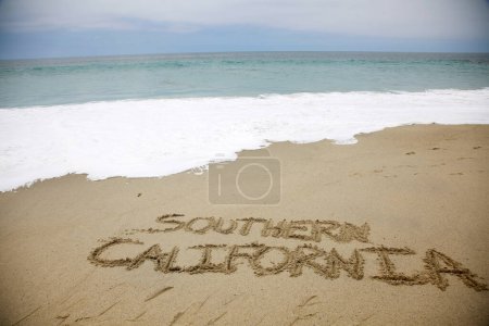 Photo for Southern California written in the sand on the beach.  message handwritten on a smooth sand beach - Royalty Free Image