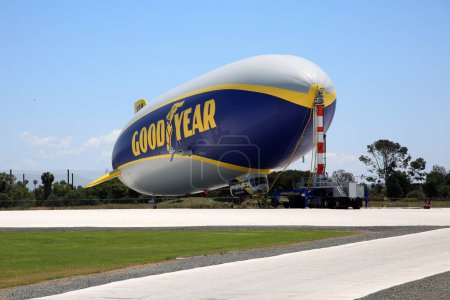 Photo for Goodyear Blimp is any one of a fleet of airships (or dirigibles) operated by the Goodyear Tire and Rubber Company, used mainly for advertising purposes and capturing aerial views of live sporting events for television. - Royalty Free Image