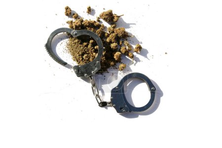Téléchargez les photos : Cannabis. Marijuana and the Law.  Cannabis Use. Cannabis and Handcuffs. - en image libre de droit