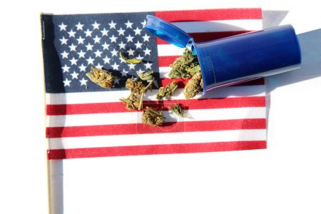 Foto de Marijuana  Buds on  USA flag isolated on white.  Medical Marijuana - Imagen libre de derechos
