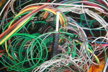 Photo for Lake Forest, California - USA - May 7 2023: Copper wire. Scrap electrical wire for recycling. Old electrical wire. Messy pile of colorful cables network chaos of multicolor wires. Construction waste - Royalty Free Image