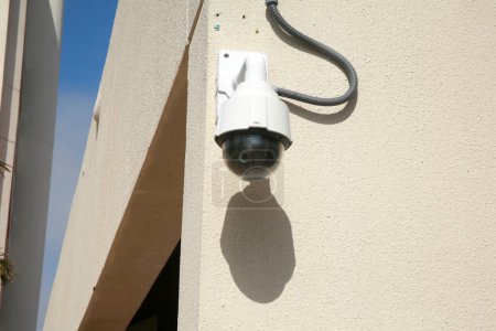 Photo for Security Camera. Closed Circuit Security Camera attached to a building. Security Camera keeps a watching eye on property to ensure safety for all. Police Camera. Police Department. - Royalty Free Image