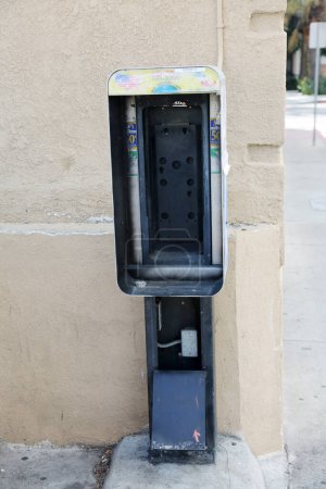 Photo for Pay Phone. Broken and Disabled Pay Telephone. Pay Phones used to be popular and used everywhere. Cell Phones are now used by everyone instead. - Royalty Free Image