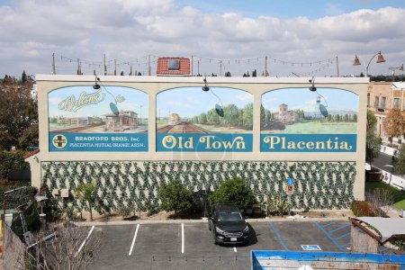 Photo for Placentia, California - USA - 3-8-2023: Old Town Placentia billboard in a Public Parking Lot. Placentia the All American City in Orange County California. A small family friendly town with history. - Royalty Free Image