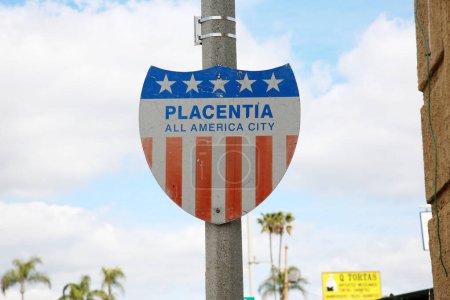 Photo for PLACENTIA All American City. City Placard for Placentia California on a light pole. Old Vintage Metal Red White and Blue Placentia City Placard sign. - Royalty Free Image