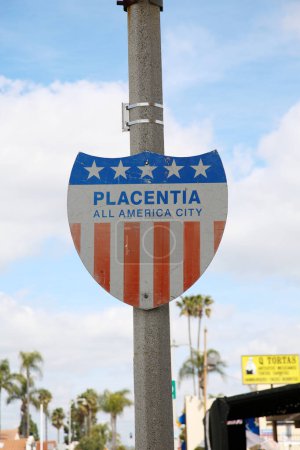 Photo for PLACENTIA All American City. City Placard for Placentia California on a light pole. Old Vintage Metal Red White and Blue Placentia City Placard sign. - Royalty Free Image