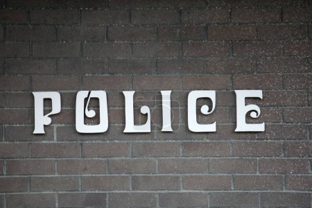 Photo for POLICE. Police Sign on a wall. Police department. Police do an important job helping to keep people safe and secure from Crime and Terror. - Royalty Free Image