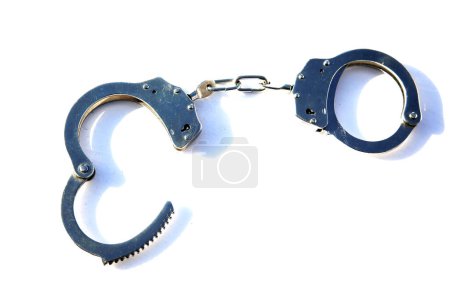 Photo for Handcuffs. Police Handcuffs. Isolated on white. Room for text. Crime and Punishment. Pair of Handcuffs. Bondage and Discipline. Placed Under Arrest. Shackles. - Royalty Free Image