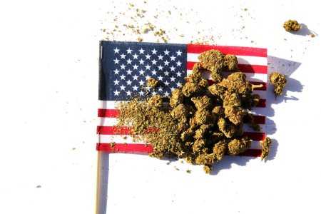 Foto de Cannabis. Legal Marijuana. Marijuana Buds with an American Flag. Female Marijuana Flowers. American Medical Marijuana. Recreational Cannabis. Cannabis flowers with the American Flag. - Imagen libre de derechos
