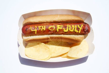 Photo for Hotdog with the text written in Yellow Mustard. Isolated on white. - Royalty Free Image