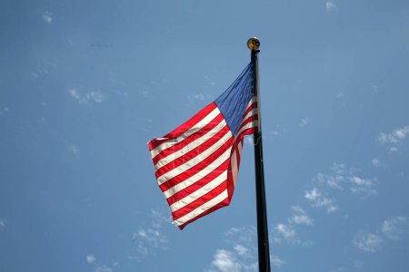 Photo for American Flag. American Flag Waving in the breeze for Memorial Day. US Flag for the 4th of July holiday. American flag fluttering in the breeze with a Blue Sky background. USA. Stars and Stripes. - Royalty Free Image