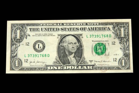 Photo for A us dollar bill isolated on black - Royalty Free Image