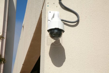 Photo for Security Camera. Closed Circuit Security Camera attached to a building. Security Camera keeps a watching eye on property to ensure safety for all. Police Camera. Police Department. - Royalty Free Image