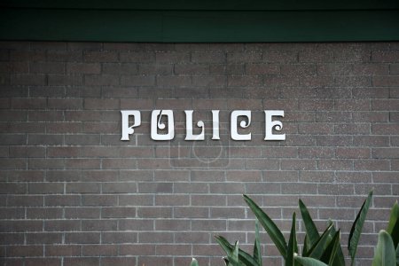 Photo for POLICE. Police Sign on a wall. Police department. Police do an important job helping to keep people safe and secure from Crime and Terror. - Royalty Free Image