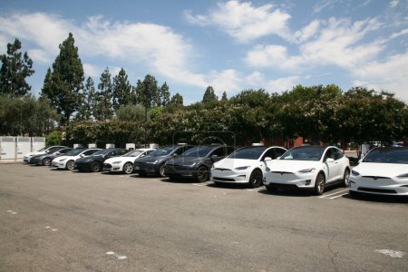 Photo for Irvine, California - USA - June 1, 2023: Tesla Electric Vehicle Charging Station. Superchargers can add up to 200 miles of range in just 15 minutes. Since charging above 80 percent is rarely necessary - Royalty Free Image