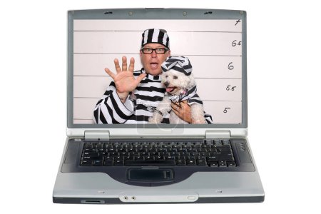 Photo for Laptop screen with man and his dog under arrest at the booking station in prison - Royalty Free Image