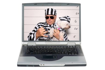 Photo for Laptop screen with man and his dog under arrest at the booking station in prison - Royalty Free Image
