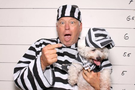 Photo for A man and his dog under arrest at the booking station in prison - Royalty Free Image