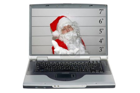 Téléchargez les photos : Un ordinateur portable avec un Père Noël est en état d'arrestation et sa photo est prise. Saint Nick DUI. Père Noël Mugshot. - en image libre de droit