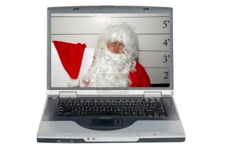 Téléchargez les photos : Un ordinateur portable avec un Père Noël est en état d'arrestation et sa photo est prise. Saint Nick DUI. Père Noël Mugshot. - en image libre de droit