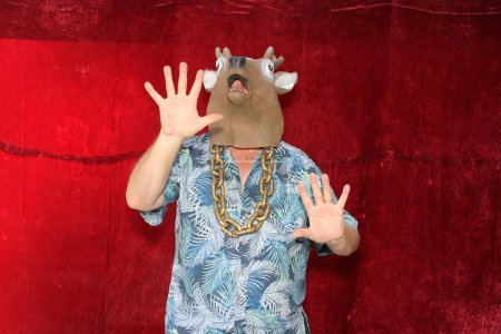 Photo for Photo Booth. A man wearing a Deer Head Mask does his best impression - Royalty Free Image