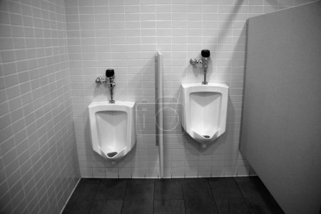 Photo for Urinal. Toilet. Restroom. Public Restroom. Urinals in a Public Bathroom. Bathroom facility. Public Toilets. Modern white urinal in the toilet. Men's toilet concept. Men's bathroom. White porcelain. - Royalty Free Image