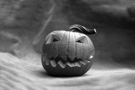Photo for Halloween. Halloween Pumpkin. A spooky Jack O Lantern. Halloween Carved Pumpkin. Holiday Special. Fun Times. Evil Fun. Funny Halloween. Funny Pumpkin. Haunted Season. Pumpkin Carving Contest. Boo. - Royalty Free Image