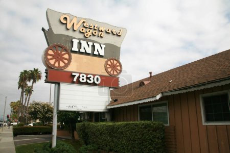 Photo for Buena Park, California - USA - September 17-2023: Westward Wagon Inn. Roadside motel in Buena Park, Ca. No-frills, air-conditioned rooms have basic furnishings and dcor. 4.6 miles from Disneyland. - Royalty Free Image