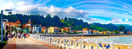 Scenic landscape of architecture and beach,harbour with boats and houses. Seafront promenade in fishing village Ribadesella, Asturias, Spain. 