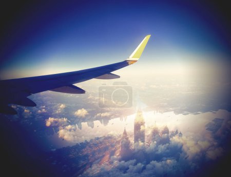 Photo for Beautiful sunset, sky on the top view, airplane flying view from inside window aircraft of Traveling.Airplane flying above clouds. - Royalty Free Image