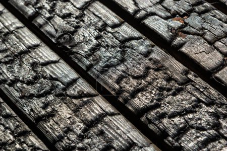 Photo for Black wooden board texture, close up. BBQ background. Burnt wooden Board texture. Burned scratched hardwood surface. Smoking wood plank background. Burned wooden grunge texture. - Royalty Free Image