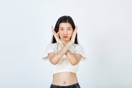 Photo for Beautiful young Asian woman Break the bias symbol of woman's international day. Crossed hands - Royalty Free Image