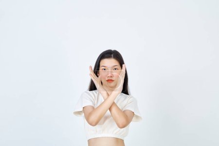 Photo for Beautiful young Asian woman Break the bias symbol of woman's international day. Crossed hands - Royalty Free Image