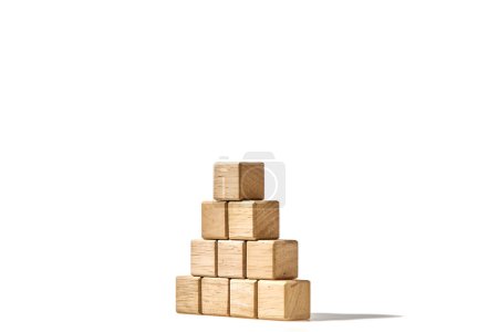 Photo for Close-up wood cubes arranges in a pyramid shape mock-up for creating symbols or logos, business growth, and management concept on white background - Royalty Free Image