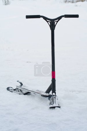 snow scooter in snow. A close up
