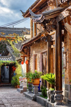 Awesome view of the Old Town of Lijiang, China. Traditional Chinese authentic buildings. Lijiang is a popular tourist destination of Asia.
