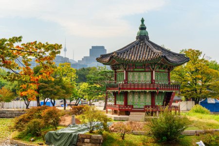 Photo for Colorful autumn view of Hyangwonjeong Pavilion at Gyeongbokgung Palace in Seoul, South Korea. Awesome pavilion of traditional Korean architecture. - Royalty Free Image