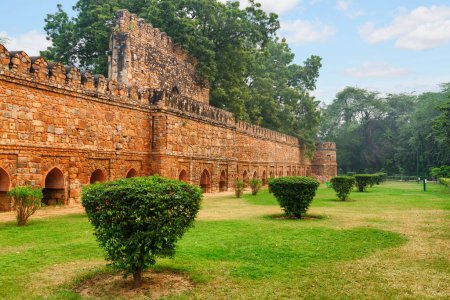 Scenic fortified walls of Sikandar Lodi's Tomb at Lodi Gardens in Delhi, India. The gardens are a popular tourist attraction of South Asia.