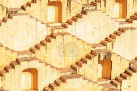 Amazing view of steps and niches of Panna Meena ka Kund reservoir in Amer town, Rajasthan, Jaipur, India. The ancient step well is a popular tourist attraction of South Asia.