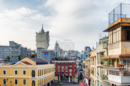 Photo for Macau - October 18, 2017: View of Grand Lisboa Casino tower among city buildings. . Macau is a popular tourist destination of Asia and leading casino market of the world. - Royalty Free Image