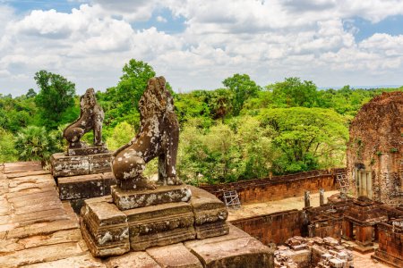 Mysterious ruins of ancient Pre Rup temple in amazing Angkor, Siem Reap, Cambodia. Enigmatic Pre Rup  nestled among rainforest. Angkor is a popular tourist attraction.