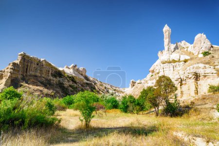 Photo for Awesome view of rock formations in the Pigeon valley in Cappadocia, Turkey. Fabulous landscape of Goreme Historical National Park. Cappadocia is a popular tourist destination of Turkey. - Royalty Free Image