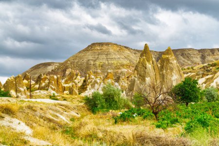 Photo for Awesome view of rock formations in Pasabag valley in Cappadocia, Turkey. Fabulous landscape of Goreme Historical National Park. Cappadocia is a popular tourist destination of Turkey. - Royalty Free Image