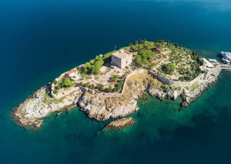 Aerial view of Guvercinada Island (Pigeon Island) with scenic castle at Kusadasi, Turkey. The large resort town is a popular tourist destination in Turkey.