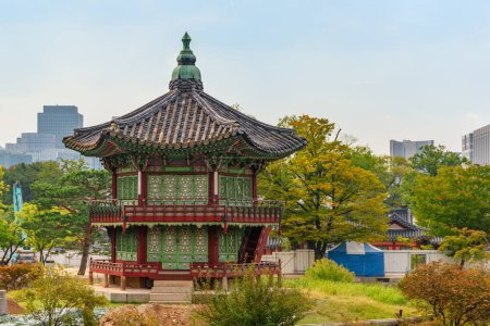 Colorful autumn view of Hyangwonjeong Pavilion at Gyeongbokgung Palace in Seoul, South Korea. Awesome pavilion of traditional Korean architecture.