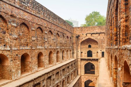 Unusual view of Agrasen ki Baoli reservoir in Delhi, India. The ancient step well is a popular tourist attraction of South Asia. Beautiful architecture of historical monument with arched niches.