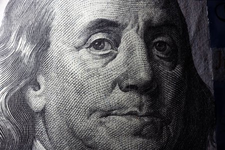Photo for 100 dollar bill with Benjamin Franklin face macro shot. Close up portrait of Benjamin Franklin on one hundred dollar bill - Royalty Free Image