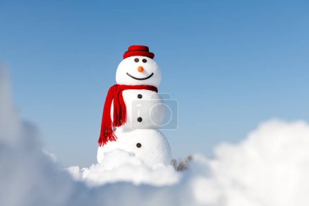 Photo for A cheerful snowman donning a fashionable red hat and matching scarf stands proudly in a snowy field, set against a clear blue sky. Christmas postcard - Royalty Free Image