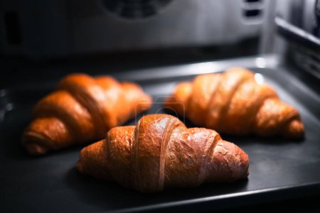 Photo for Croissants are baked in the home oven. Food photography - Royalty Free Image